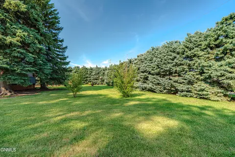 Exterior - 705 3rd Ave SE, Mandan, ND 58554 photo 7 of 12