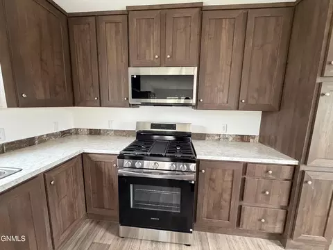 Kitchen - 703 6th Ave SE, Mandan, ND 58554 photo 2 of 2