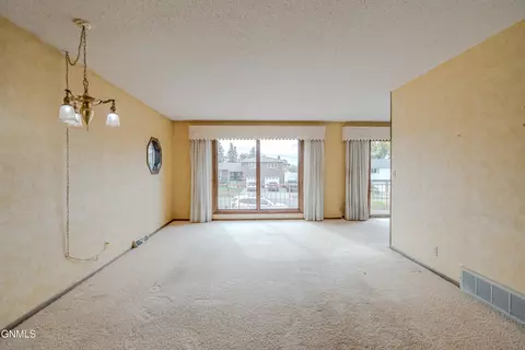 Living - 618 Interstate Ave W, Bismarck, ND 58503 photo 2 of 5