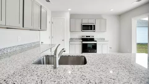 Kitchen - 1213 Skystone Loop NE, Supply, NC 28462 photo 2 of 10