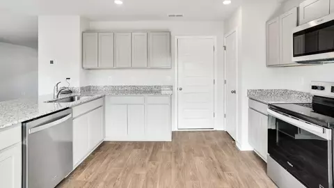 Kitchen - 1213 Skystone Loop NE, Supply, NC 28462 photo 4 of 10