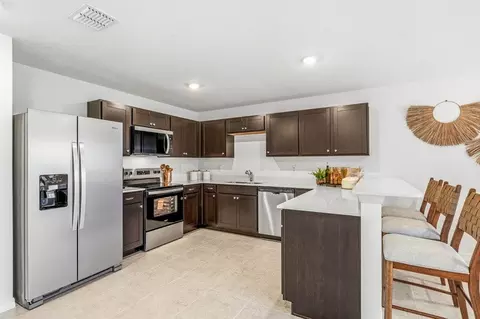 Kitchen - 8765 Pine Bark Way, Wildwood, FL 34785 photo 3 of 4