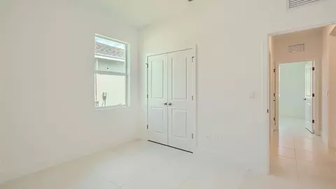 Bedroom - 6510 SE Park Trace Dr, Stuart, FL 34997 photo 5 of 15