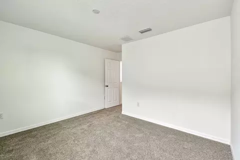 Bedroom - 13718 Chestnut Ridge Dr, Hudson, FL 34669 photo 7 of 9