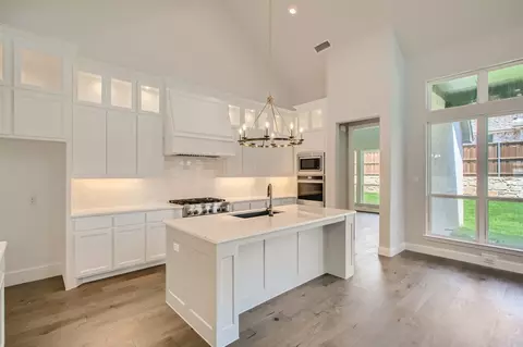 Kitchen - 910 Shooting Star Dr, Prosper, TX 75078 photo 3 of 7