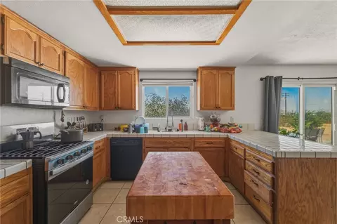 Kitchen - 15072 Desert Star Rd, Apple Valley, CA 92307 photo 2 of 2