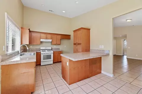 Kitchen - 14336 Caroline, Adelanto, CA 92301 photo 1 of 2