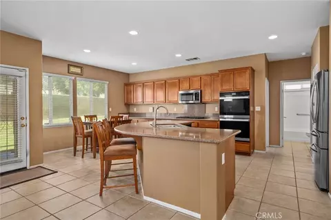 Kitchen - 13714 River Downs St, Eastvale, CA 92880 photo 2 of 4