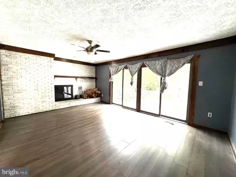 Living - 7635 Stoney Creek Dr, Pasadena, MD 21122 photo 9 of 10