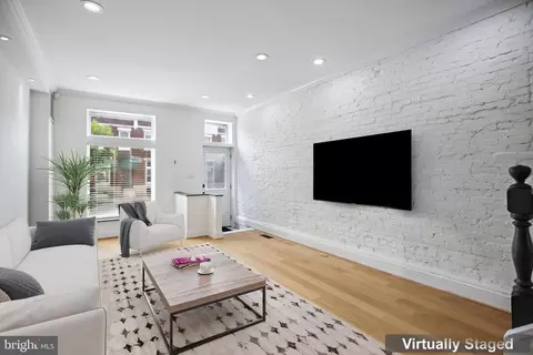 Living - 831 N Luzerne Ave, Baltimore, MD 21205 photo 1 of 8