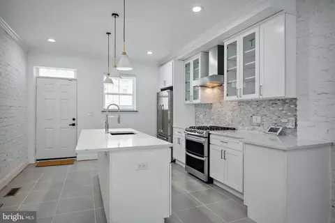 Kitchen - 831 N Luzerne Ave, Baltimore, MD 21205 photo 2 of 3