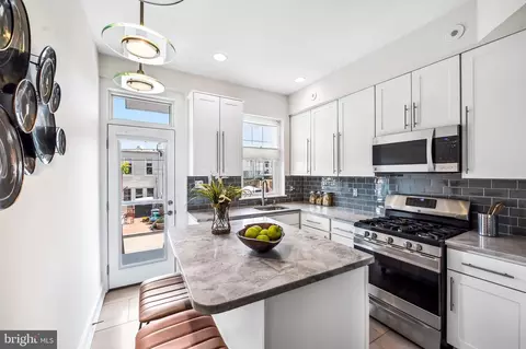 Kitchen - 5 N Luzerne Ave, Baltimore, MD 21224 photo 1 of 2