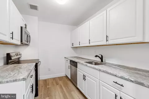 Kitchen - 312 E 22nd St, Baltimore, MD 21218 photo 1 of 2