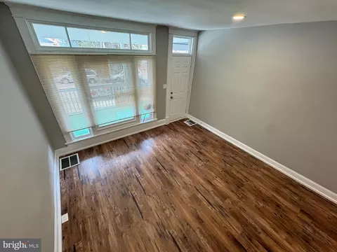 Living - 831 Belgian Ave, Baltimore, MD 21218 photo 2 of 5