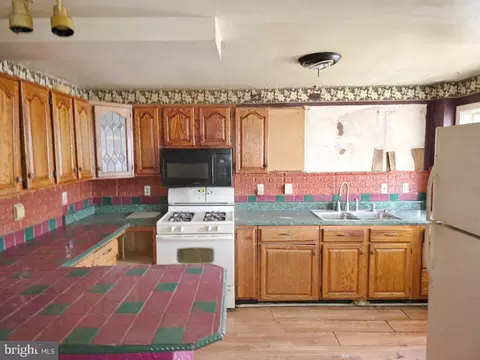 Kitchen - 3731 Elmley Ave, Baltimore, MD 21213 photo 1 of 2