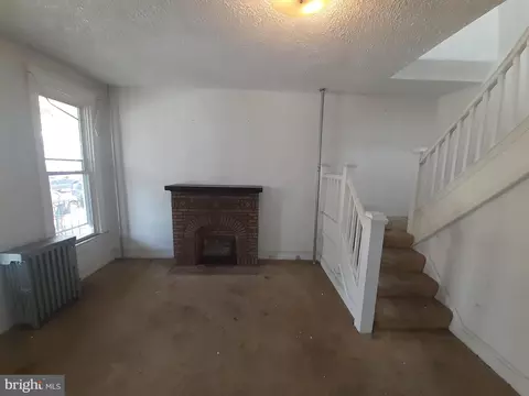 Living - 517 E 38th St, Baltimore, MD 21218 photo 3 of 4