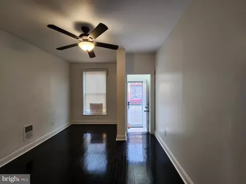 Living - 409 S Mount St, Baltimore, MD 21223 photo 1 of 2