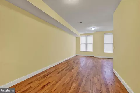 Living - 221 E Lafayette Ave, Baltimore, MD 21202 photo 4 of 7