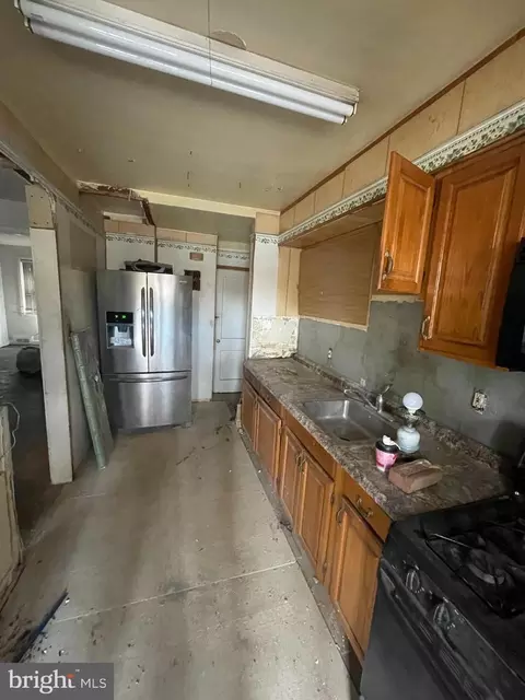Kitchen - 1312 E Cold Spring Ln, Baltimore, MD 21239 photo 3 of 3