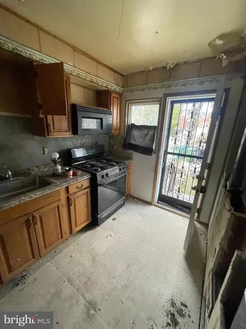 Kitchen - 1312 E Cold Spring Ln, Baltimore, MD 21239 photo 2 of 3