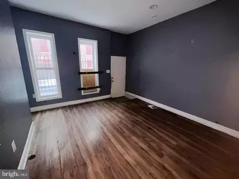 Living - 207 S Pulaski St, Baltimore, MD 21223 photo 2 of 3