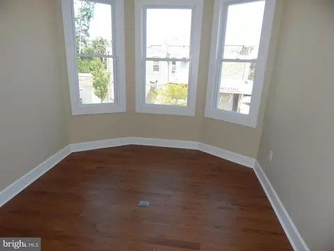 Living - 3042 E Monument St, Baltimore, MD 21205 photo 6 of 8