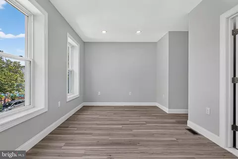 Living - 319 E 24th St, Baltimore, MD 21218 photo 2 of 2