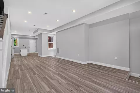 Living - 319 E 24th St, Baltimore, MD 21218 photo 1 of 2