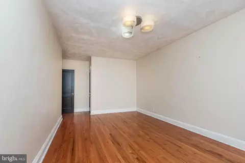 Living - 703 N Augusta Ave, Baltimore, MD 21229 photo 2 of 3