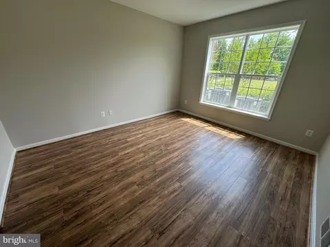Living - 7101 Travertine Dr #105, Baltimore, MD 21209 photo 6 of 8