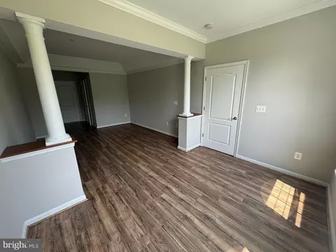 Living - 7101 Travertine Dr #105, Baltimore, MD 21209 photo 3 of 8