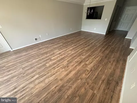 Living - 7101 Travertine Dr #105, Baltimore, MD 21209 photo 4 of 8