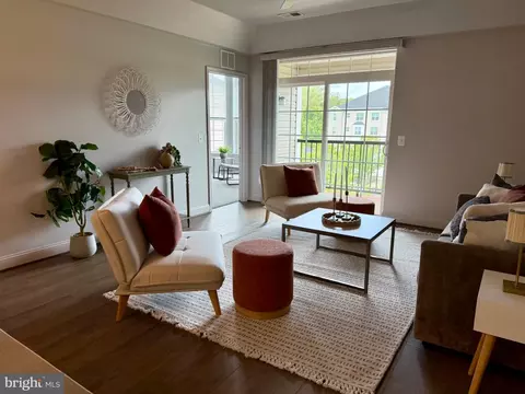 Living - 7701 Travertine Dr #401, Baltimore, MD 21209 photo 2 of 7