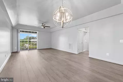 Living - 7701 Travertine Dr #401, Baltimore, MD 21209 photo 3 of 7