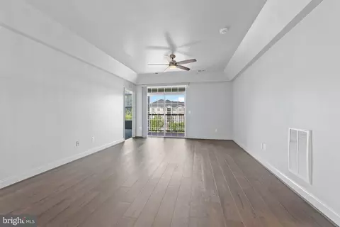 Living - 7701 Travertine Dr #401, Baltimore, MD 21209 photo 4 of 7