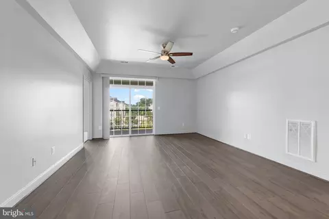 Living - 7701 Travertine Dr #401, Baltimore, MD 21209 photo 5 of 7