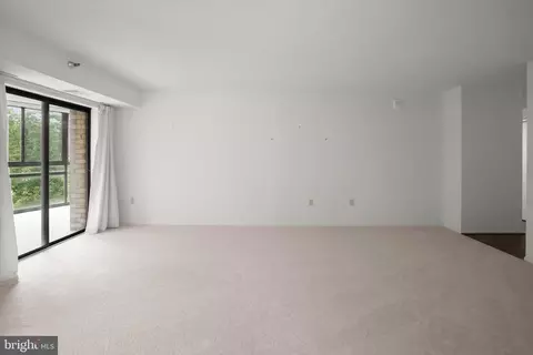 Living - 15101 Interlachen Dr #1-618, Silver Spring, MD 20906 photo 4 of 7