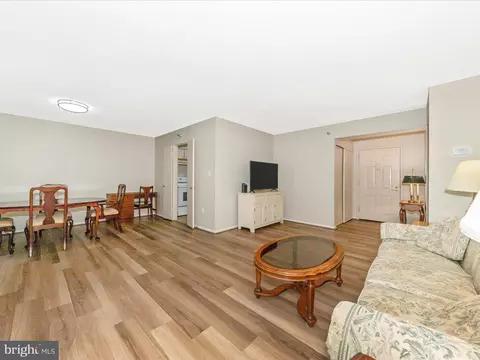 Living - 15101 Interlachen Dr #1-116, Silver Spring, MD 20906 photo 4 of 7