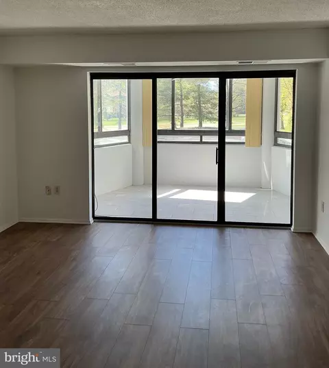 Living - 15101 Interlachen Dr #1-124, Silver Spring, MD 20906 photo 2 of 3