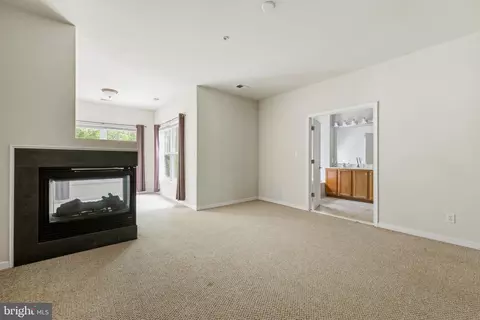 Living - 11964 W War Dancer Ln #103, Berlin, MD 21811 photo 7 of 10