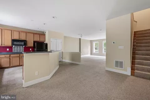 Living - 11964 W War Dancer Ln #103, Berlin, MD 21811 photo 5 of 10