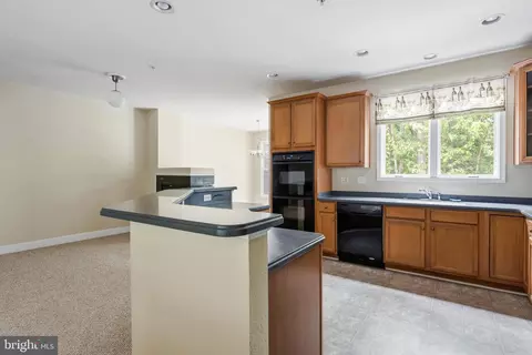 Kitchen - 11964 W War Dancer Ln #103, Berlin, MD 21811 photo 2 of 3