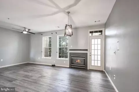 Living - 1300 Windleaf Dr #G, Reston, VA 20194 photo 2 of 3