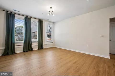 Living - 1669 Bandit Loop #105A, Reston, VA 20190 photo 2 of 5