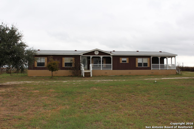 760 County Road 761, Devine, TX 78016 photo 1