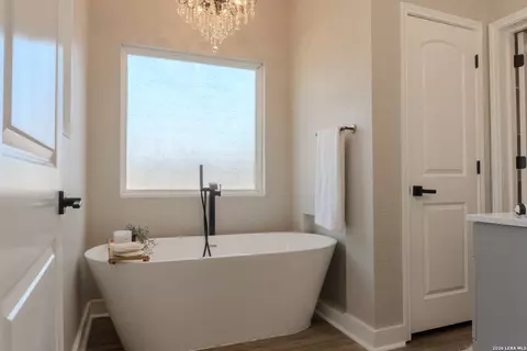 Bath - 185 E Medium Mdw, Lytle, TX 78052 photo 1 of 6