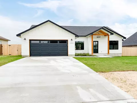 Exterior - 1206 Devine Dr, Devine, TX 78016 photo 2 of 9