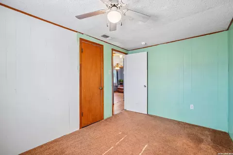 Bedroom - 619 Webb Ave, Devine, TX 78016 photo 3 of 4