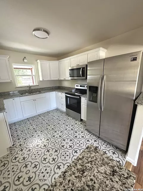 Kitchen - 907 Dove Ave, Devine, TX 78016 photo 2 of 2