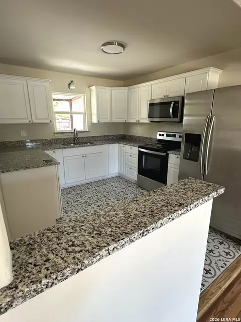 Kitchen - 907 Dove Ave, Devine, TX 78016 photo 1 of 2